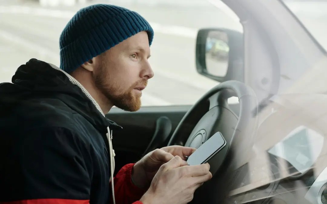 Driver using the Grasshopper Labs TMS system mobile app on a last mile delivery route